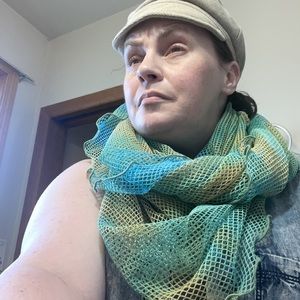 This never-worn netting scarf is unbelievably soft and very lightweight.